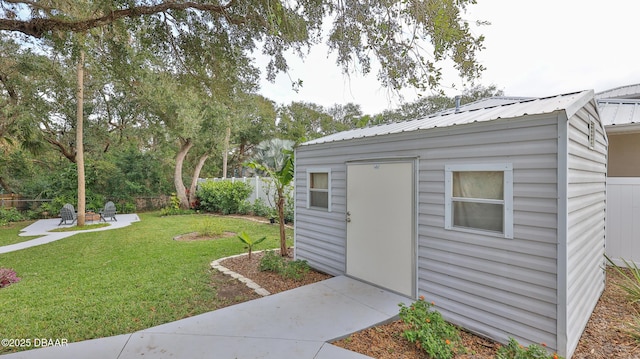 view of outbuilding featuring an outdoor structure and fence private yard