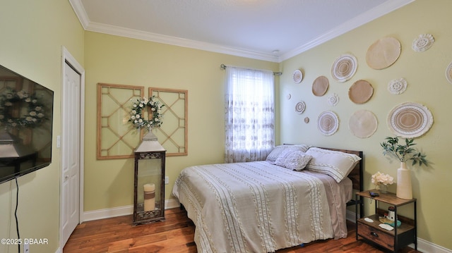 3368 Marsili Ave, New Smyrna Beach, FL 32168 - bedroom with wood finished floors and crown molding