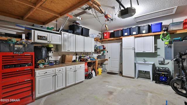 3368 Marsili Ave, New Smyrna Beach, FL 32168 - garage featuring a garage door opener and a workshop area
