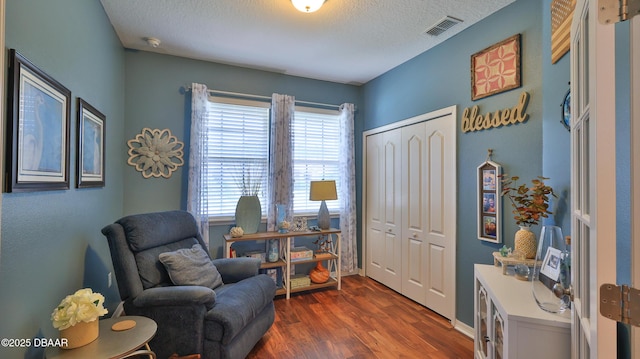 3368 Marsili Ave, New Smyrna Beach, FL 32168 - sitting room with healthy amount of natural light, dark wood-type flooring, and a textured ceiling