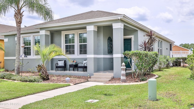 3368 Marsili Ave, New Smyrna Beach, FL 32168 - view of front facade featuring stucco siding, a front yard, and a shingled roof