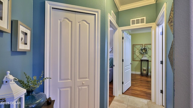 3368 Marsili Ave, New Smyrna Beach, FL 32168 - corridor with crown molding and tile patterned floors