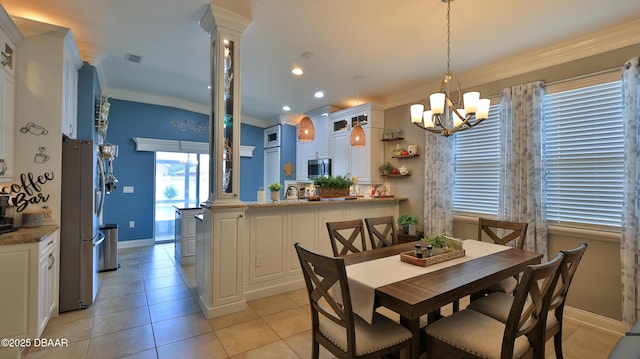 3368 Marsili Ave, New Smyrna Beach, FL 32168 - dining room featuring a chandelier, crown molding, and light tile patterned floors