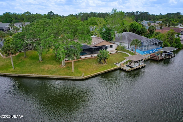 birds eye view of property with a water view