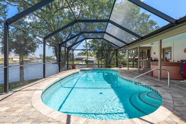 pool with a lanai, a patio, and outdoor dry bar