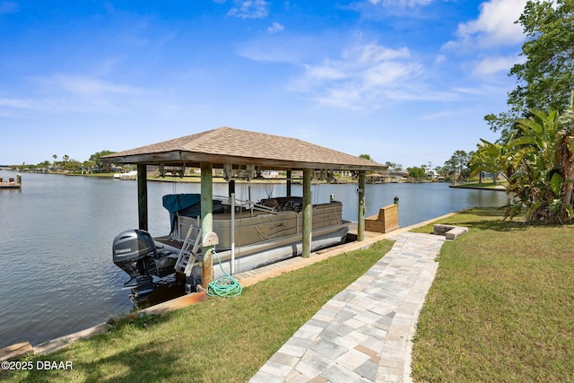 view of dock featuring a water view, a yard, and boat lift