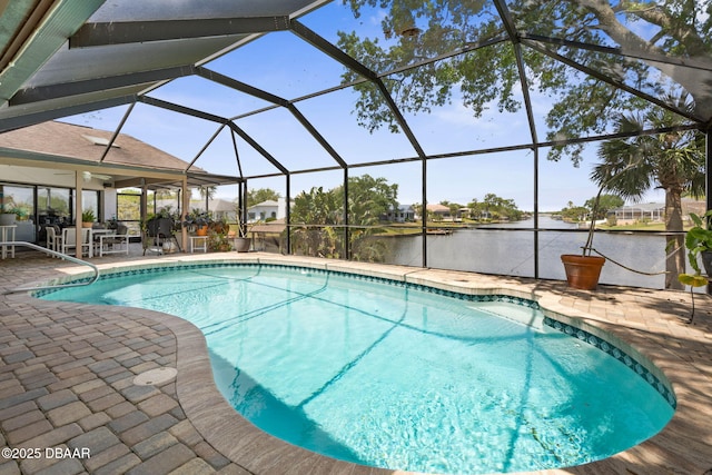 pool featuring a water view, glass enclosure, and a patio