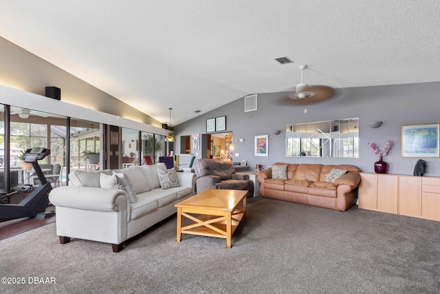 carpeted living room featuring a healthy amount of sunlight, lofted ceiling, and visible vents