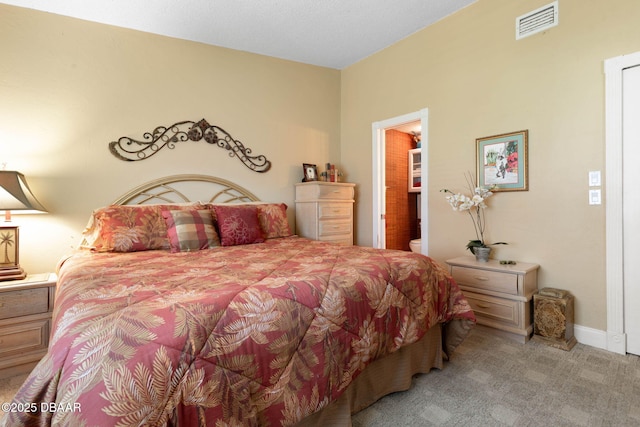 bedroom featuring visible vents, baseboards, and light colored carpet