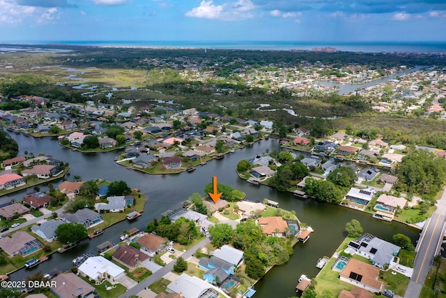 aerial view featuring a residential view and a water view
