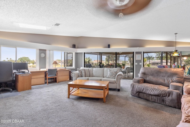 living area featuring light carpet, visible vents, lofted ceiling, and a textured ceiling