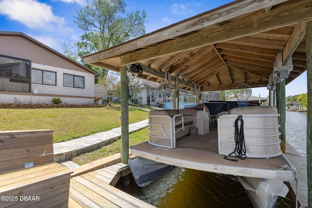 dock area with a water view and a lawn