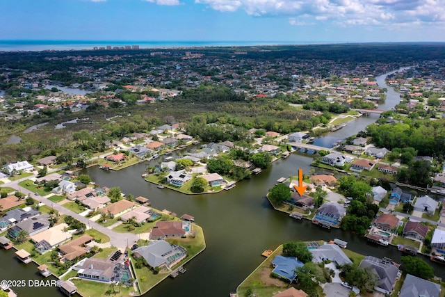 bird's eye view featuring a water view and a residential view