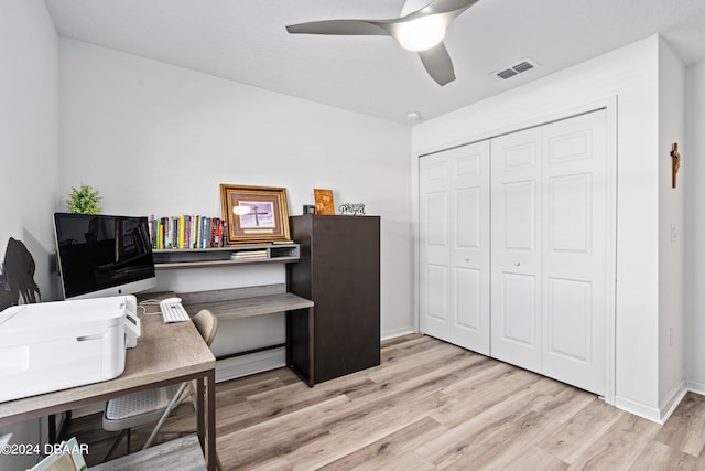 office area with light wood-type flooring and ceiling fan