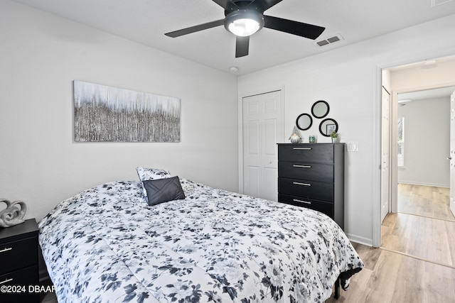 bedroom with ceiling fan and light hardwood / wood-style flooring