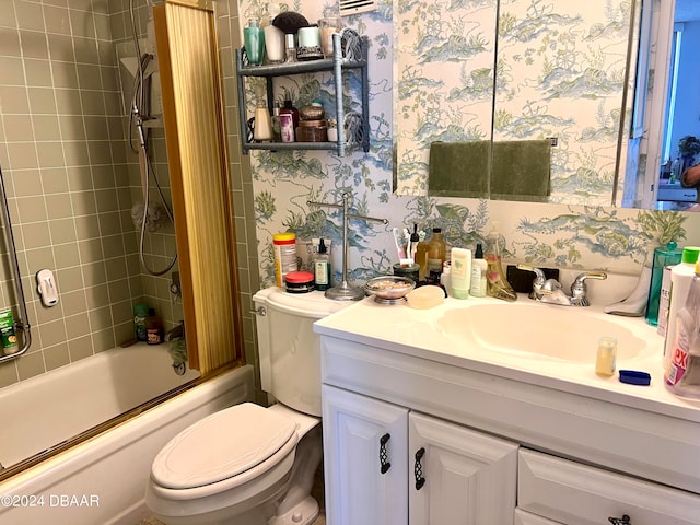 full bathroom featuring vanity, toilet, and tiled shower / bath combo