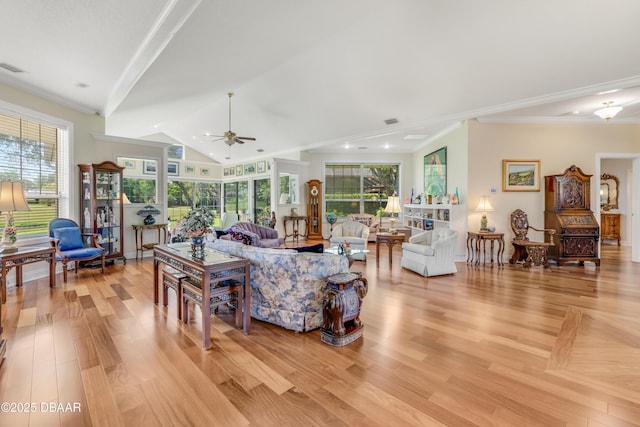 203 Prestwick Dr, New Smyrna Beach, FL 32168 - living room featuring a ceiling fan, light wood-style floors, crown molding, and lofted ceiling