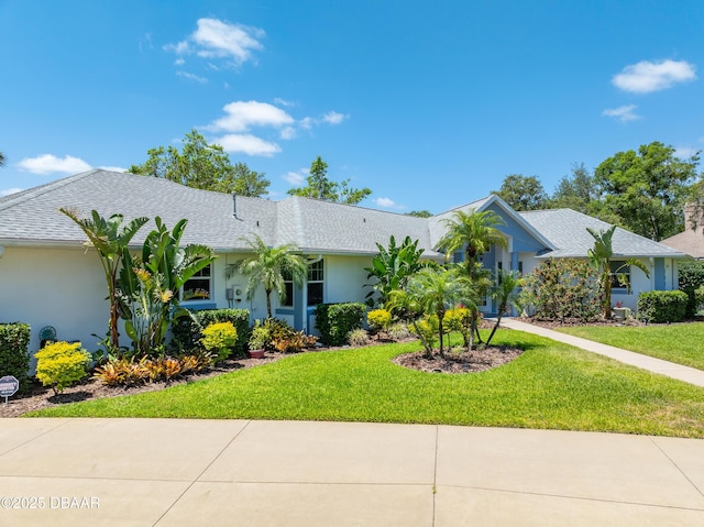 203 Prestwick Dr, New Smyrna Beach, FL 32168 - ranch-style house with stucco siding and a front lawn