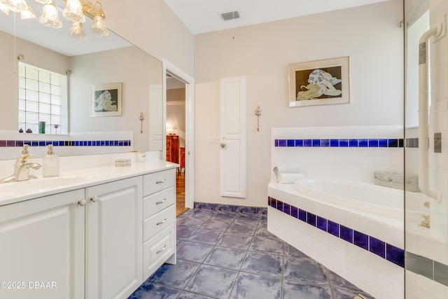 203 Prestwick Dr, New Smyrna Beach, FL 32168 - bathroom with a bath, vanity, tile patterned floors, and a chandelier