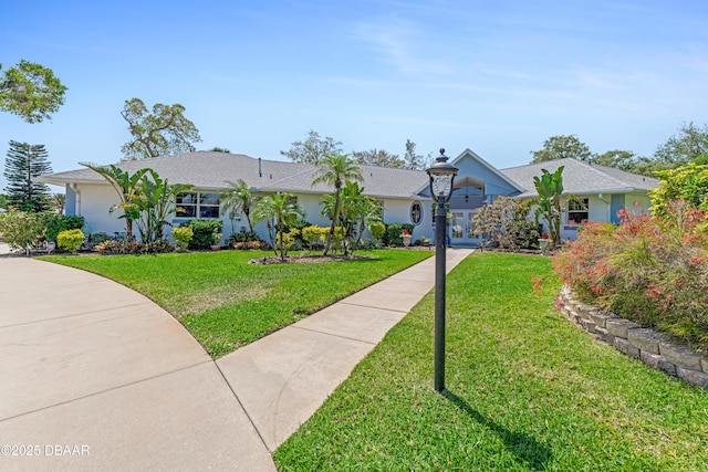203 Prestwick Dr, New Smyrna Beach, FL 32168 - single story home featuring french doors, a front yard, and stucco siding