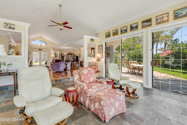 203 Prestwick Dr, New Smyrna Beach, FL 32168 - living room with ceiling fan, lofted ceiling, french doors, stone tile flooring, and ornamental molding