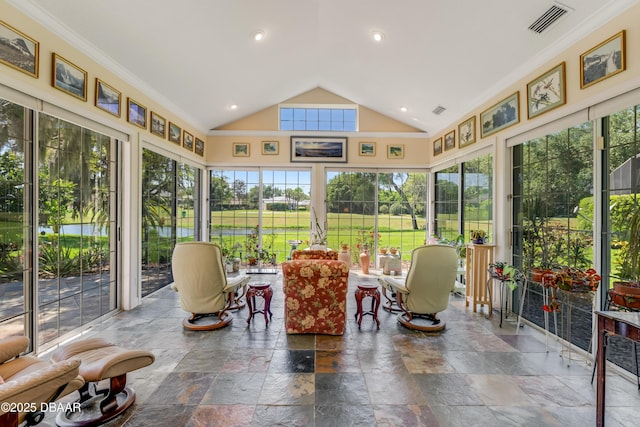 203 Prestwick Dr, New Smyrna Beach, FL 32168 - sunroom with vaulted ceiling, crown molding, stone tile flooring, and plenty of natural light