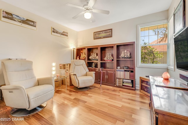203 Prestwick Dr, New Smyrna Beach, FL 32168 - living area featuring light wood-style flooring and a ceiling fan