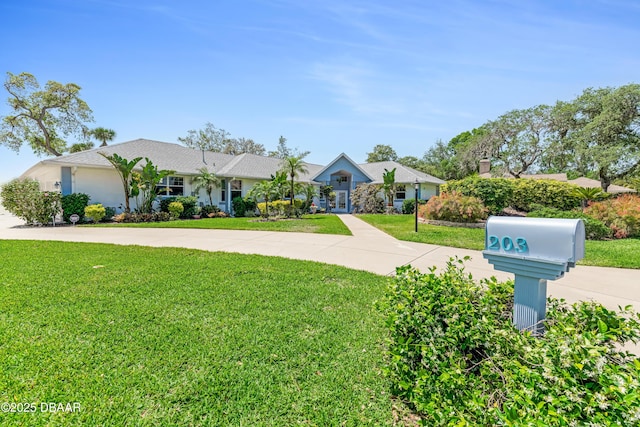 203 Prestwick Dr, New Smyrna Beach, FL 32168 - single story home with a front lawn