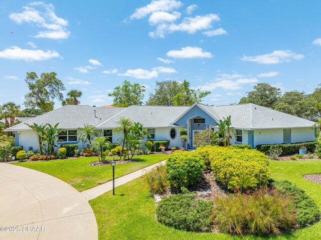 203 Prestwick Dr, New Smyrna Beach, FL 32168 - ranch-style home with a front lawn and stucco siding