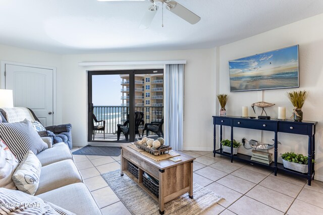 tiled living room with ceiling fan