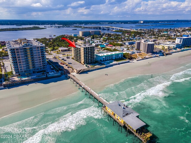 bird's eye view with a view of the beach and a water view