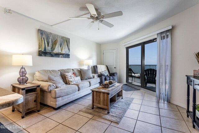 tiled living room featuring ceiling fan