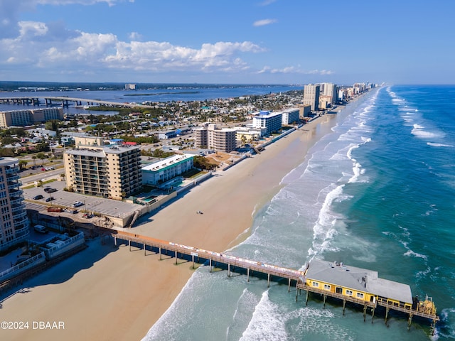 birds eye view of property with a view of the beach and a water view