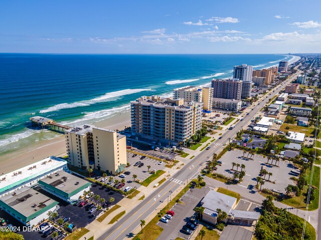 aerial view featuring a view of the beach and a water view