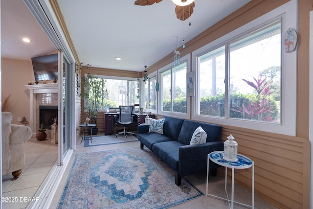 sunroom / solarium featuring plenty of natural light, recessed lighting, and tile patterned floors
