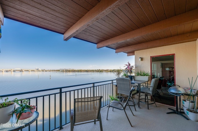 balcony featuring a water view