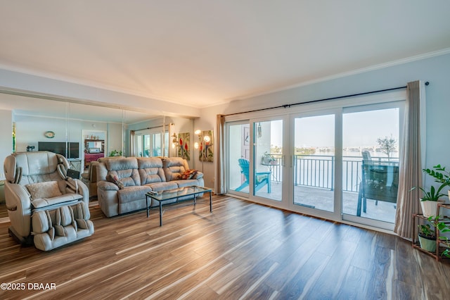 living room with ornamental molding, french doors, and wood finished floors