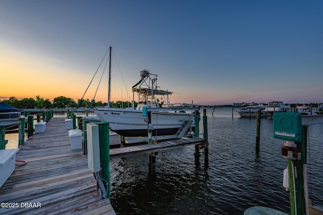 view of dock featuring a water view and boat lift