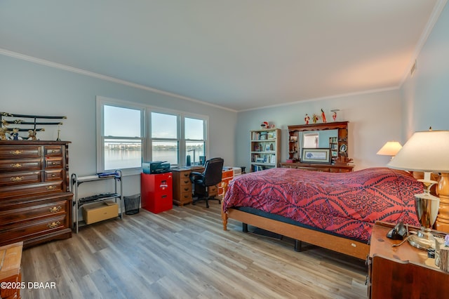 bedroom featuring wood finished floors and ornamental molding