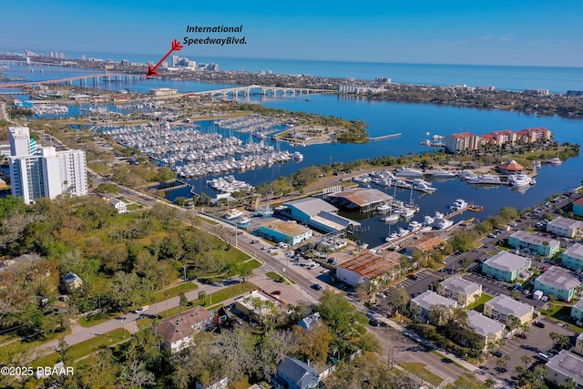 birds eye view of property with a water view