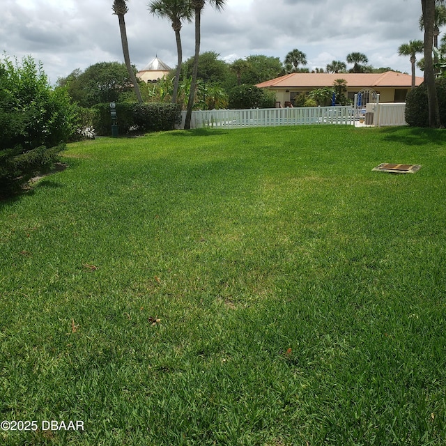 view of yard featuring fence