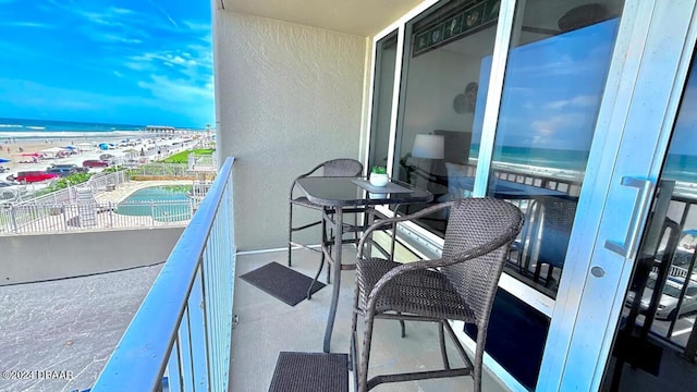 balcony featuring a water view