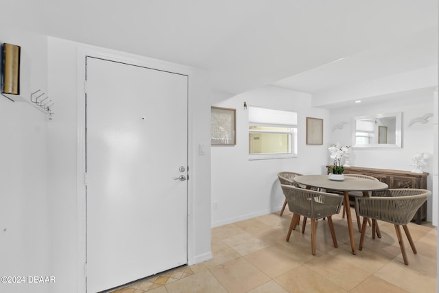 dining area with light tile patterned flooring