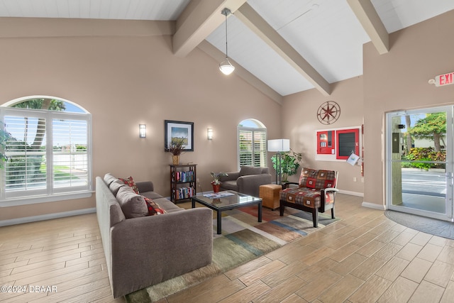 living room with beam ceiling, light hardwood / wood-style flooring, and high vaulted ceiling