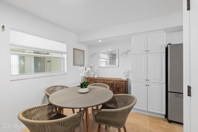 tiled dining room featuring a wealth of natural light