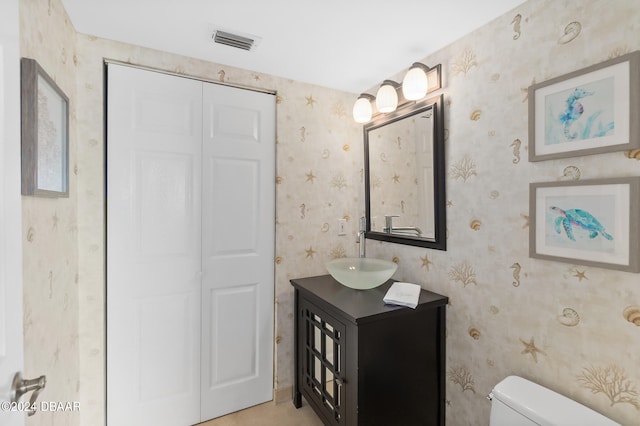 bathroom with vanity and toilet