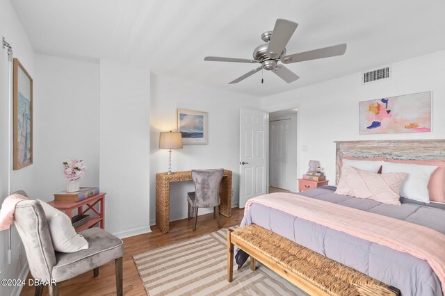 bedroom with ceiling fan and light hardwood / wood-style flooring