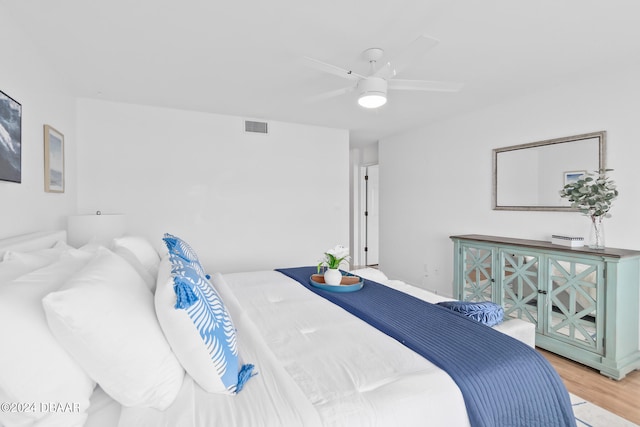 bedroom featuring ceiling fan and wood-type flooring