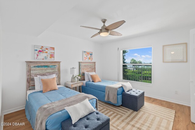 bedroom featuring light hardwood / wood-style floors and ceiling fan