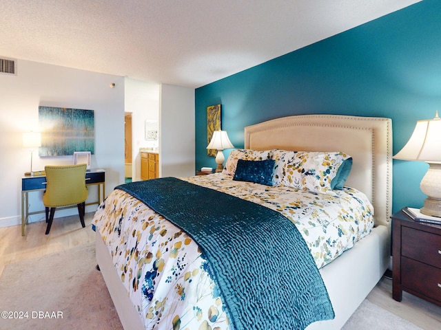 carpeted bedroom with a textured ceiling